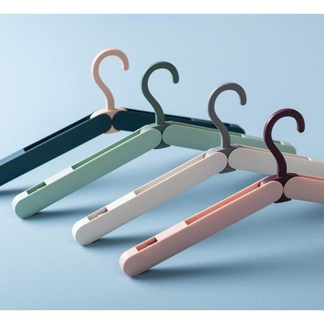 4 cintres pliables voyage en plastique (1/5)