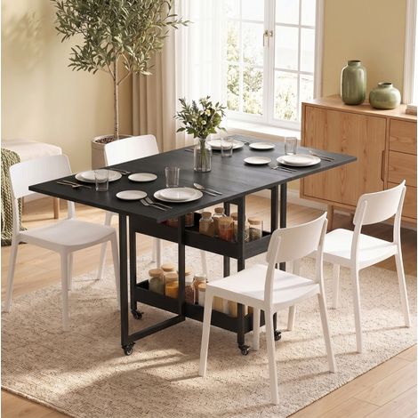 Mesa de comedor plegable para hasta 4 personas con alas abatibles, 2 estantes abiertos y ruedas con freno, negra, tablero MDF, estilo industrial – CHICFURN (1/5)