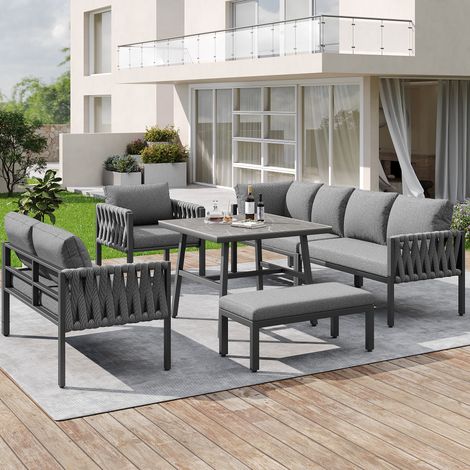 Set di mobili da giardino in metallo grigio con divano angolare, poltrona, panca, tavolo in vetro temperato e cuscini (1/5)