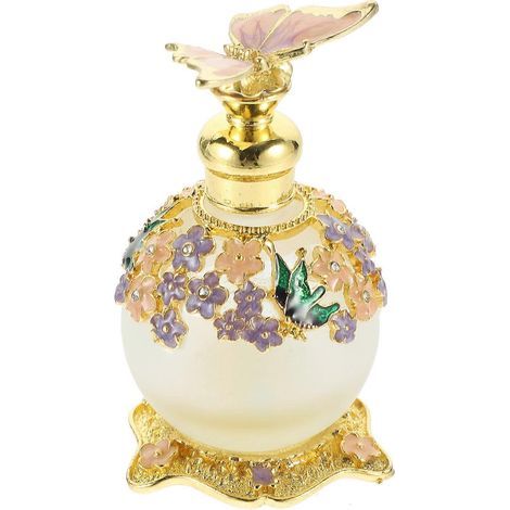 Un flacon de parfum vide. flacon de rangement pour parfum en verre et métal violet. idéal pour la décoration intérieure. (1/5)