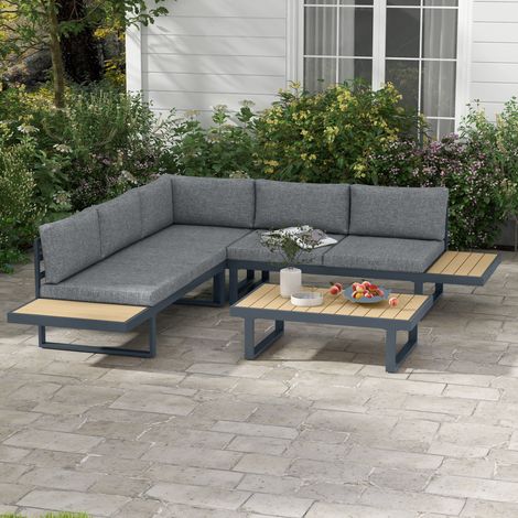 Set da salotto angolare da giardino di design con 5 sedute, cuscini e tavolino da caffè in alluminio color grigio antracite con effetto legno.