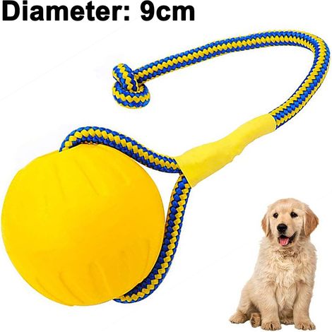 Balle pour chien en caoutchouc naturel avec corde, idéale pour rapporter, éduquer et jouer, parfaite pour les chiens actifs. (1/5)