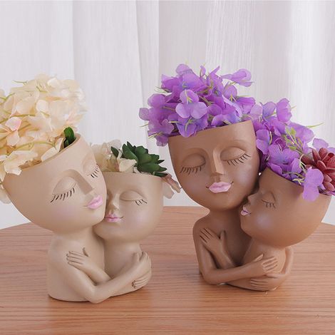 Pot de fleurs à double tête humaine, artisanat en résine, composition florale (1/5)
