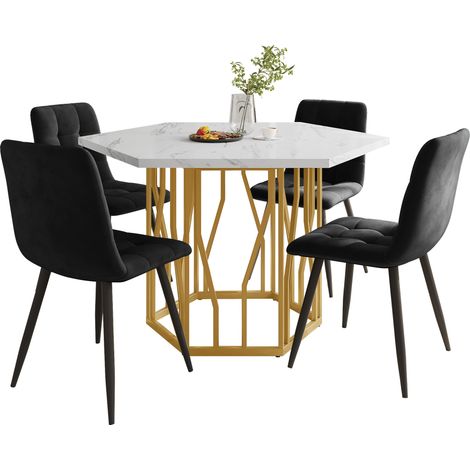 Ensemble table hexagonale marbre 5 pièces avec 4 chaises velours noir,pieds de table dorés ambiance chaleureuse.