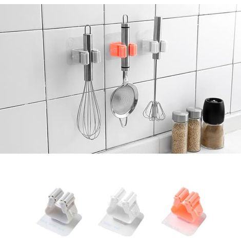 Support mural rose pour outils de nettoyage (1/5)