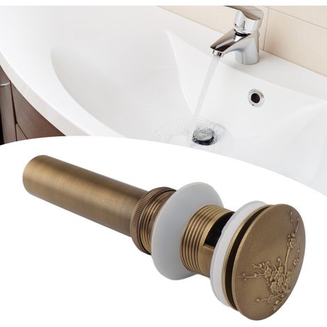 Bonde de lavabo ancienne en cuivre, avec trous, à ressort. (1/5)