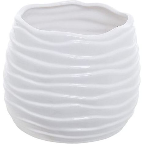 Modern ceramic flower pot in red, has a drainage hole and a wavy design. (1/5)