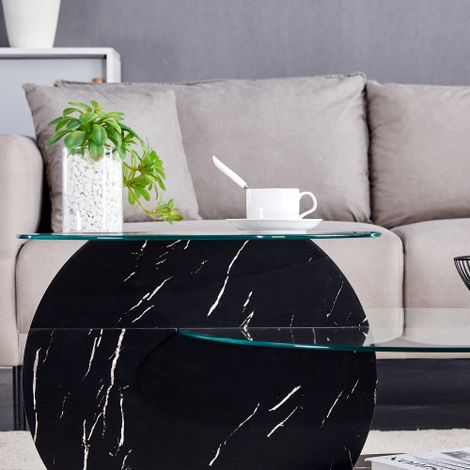 Table basse moderne et minimaliste, dotée d'un plateau en verre trempé et d'un design à niveaux multiples, reposant sur une structure en MDF de haute qualité aux finitions noires texturées. Disponible