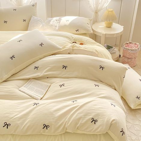 Parure de lit 2 pièces, pour fille, housse de couette 135 x 200 cm et taie d'oreiller de 40 x 80 cm, en microfibre renforcée, blanc crème avec nœuds noirs (1/5)