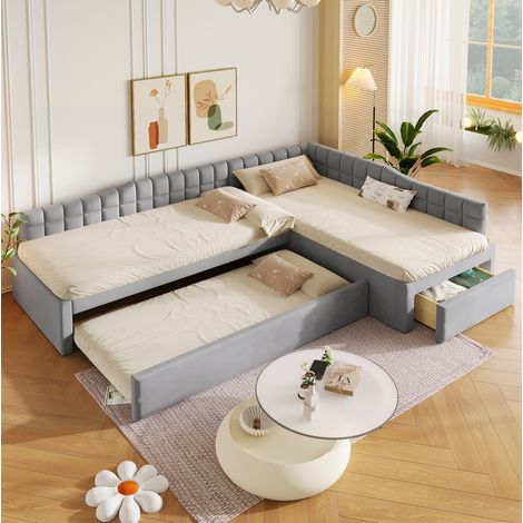 Cama infantil esquinera en forma de L de 90x200 cm con cama nido, cajones y tapicería de franela gris, ahorra espacio.
