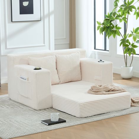 Divano pouf 151x133x64 cm, tasche laterali, due cuscini, braccioli, velluto a coste beige (1/5)