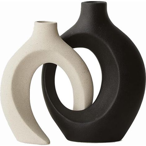 Ein Set aus zwei hohlen Keramikvasen im modernen nordisch-bohemischen Stil, geeignet für die Inneneinrichtung (schwarz und weiß). (1/5)