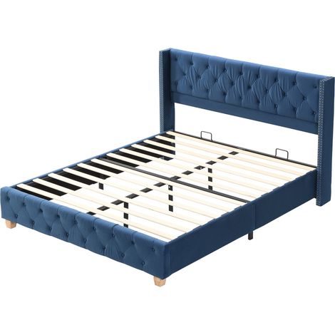 Letto capitonné 160 x 200 cm in velluto blu con rete e testiera, piedi in legno (1/5)