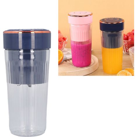 Extracteur de jus multifonctionnel avec gobelet mélangeur électrique portable, savourez facilement vos jus grâce à sa tête bleue à 6 lames. (1/5)