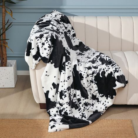 Esta alfombra decorativa presenta un motivo de vaca y otros animales. Disponible en blanco y negro, es ideal para camas e incluso para exteriores. Su superficie de piel sintética de doble cara la hace (1/5)