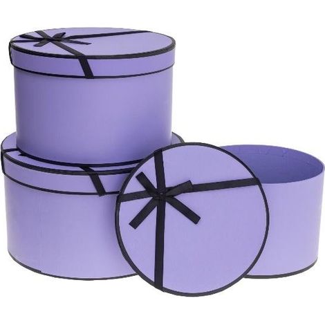 Scatola di fiori con fiocco e 3 rosette viola