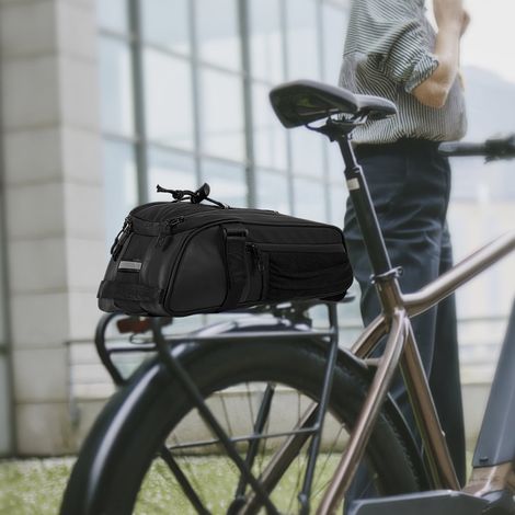 Borsa portabiciclette multifunzionale e impermeabile, ideale per portapacchi, con spallacci regolabili e numerose tasche laterali. (1/4)