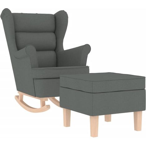 Un fauteuil à bascule avec repose-pieds, en tissu gris foncé. (1/5)