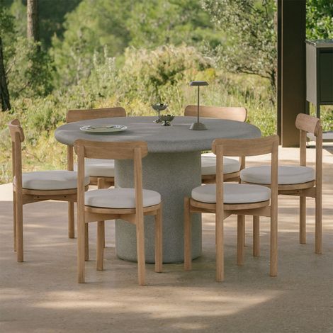 Set da tavolo rotondo Ø120 cm in cemento Emiria e 6 sedie da giardino in legno di acacia Nualis SKLUM            