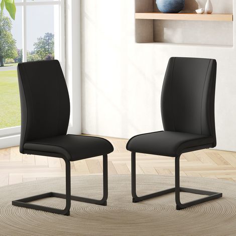Set de 2 sillas de comedor negras de polipiel con patas metálicas y respaldo ergonómico (1/5)