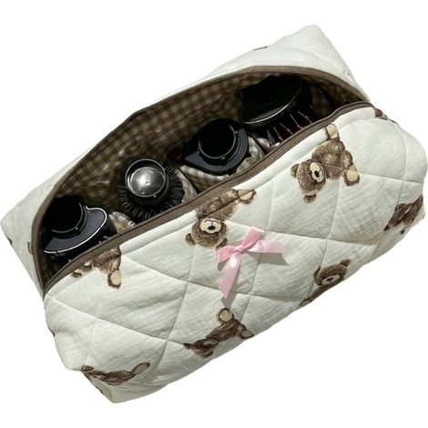 Bolsa de almacenamiento práctica con diseño de oso y estampado textil.