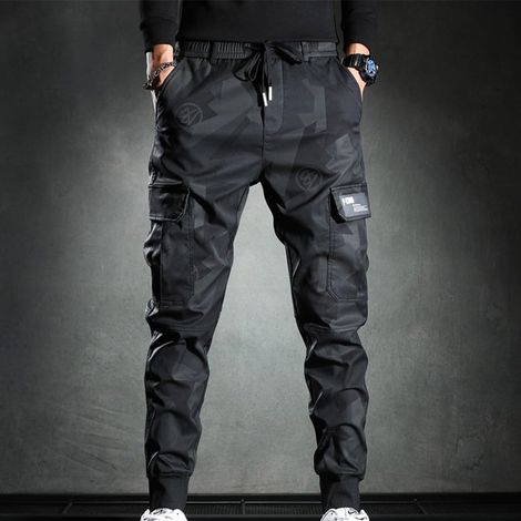 Men's thick, loose-fitting jogging pants with an athletic print. Warm and comfortable for winter, running, the gym, and casual wear. Made of polyester. Sizes M to 3XL. (1/5)