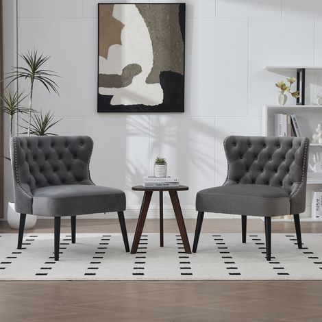 Fauteuil en velours gris sans accoudoirs, garniture cloutée, pieds bois massif – design moderne pour salon ou chambre (1/4)