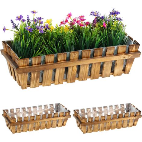 3 jardineras con aspecto de valla de madera