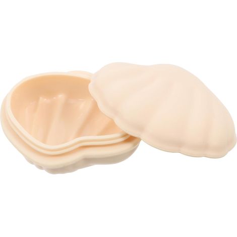 Elegante portagioie a forma di conchiglia in silicone beige. (1/5)