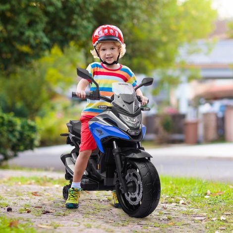 Moto eléctrica Honda para niños de 3 a 6 años con música y faros azules.