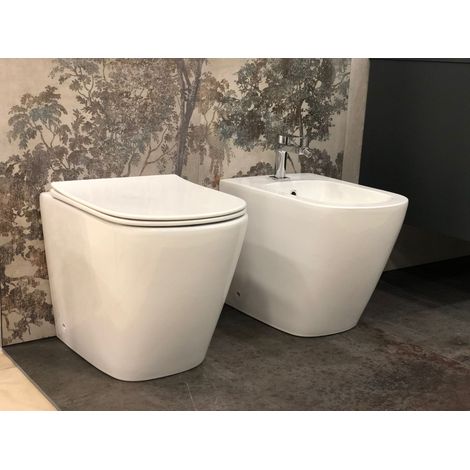 Conjunto de Sanitarios de Suelo Moon Sin Brida con Descarga Rimless, inodoro, bidé y asiento con cierre suave, incluye fijaciones y curva técnica (1/5)