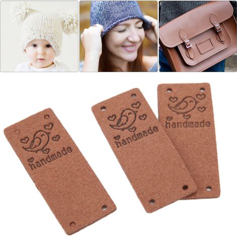 Etiqueta de cuero sintético PU de color marrón oscuro, paquete de 100 unidades con 4 agujeros, apta para coser en sombreros y carteras.