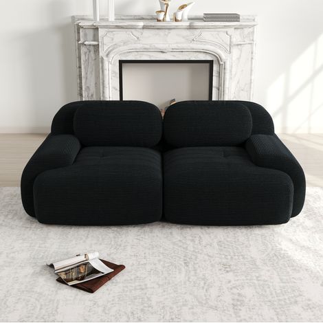 Canapé de esquina modular de pana negra sin estructura rígida, con apoyabrazos curvos y base antideslizante (1/5)