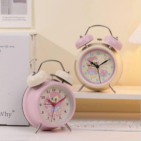 Ce réveil rose à motifs de dessins animés est doté d'une veilleuse et est spécialement conçu pour les élèves du primaire. Il possède un volume sonore élevé, un design adorable et est idéal pour être p (1/5)