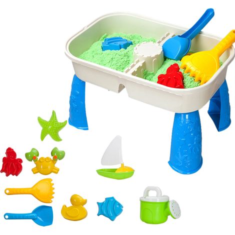 Spieltisch für Kinder mit Sand und Wasser sowie 9 Strandspielzeugen. (1/5)