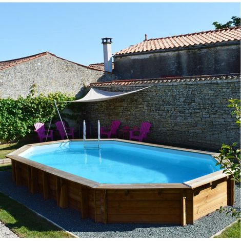 GRE – Piscine hors sol en bois traité autoclave IV – Ovale 6,56m x 4,56m x H: 1,31m – Volume 24,7m³ – Surface de nage 21,9m² (1/5)