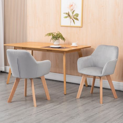 Ensemble de 2 chaises de salle à manger grises, revêtues de velours, avec accoudoirs et pieds en bois. (1/5)