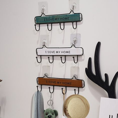 Cet ensemble comprend trois porte-manteaux muraux, chacun doté de quatre crochets, avec un design à barre transversale alliant bois et métal. (1/5)