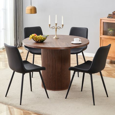 Ensemble de table ronde minimaliste avec 1 table et 4 chaises. Table à manger ronde en MDF de 100 cm de diamètre aspect noyer. Livré avec 4 chaises en similicuir noir (PU).
