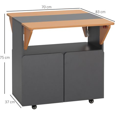 Table pliante peu encombrante. Convient pour 4 personnes maximum. Équipée de 4 roulettes, d'une étagère dissimulée et d'un placard avec porte. Dimensions : 70 x 83 x 75 cm (1/5)