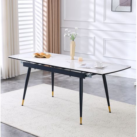 Mesa de comedor extensible 200/140 cm blanca efecto mármol, patas de metal negro y detalles dorados (1/5)