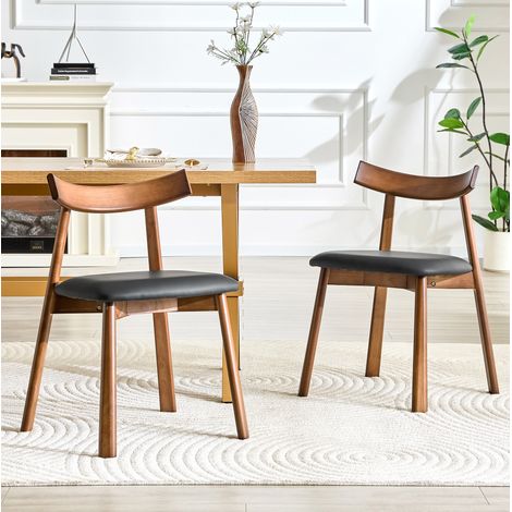 Lot de 2 chaises de salle à manger scandinaves, bois hévéa et similicuir noir (1/5)