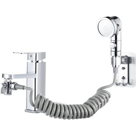 Le robinet est relié à une douche à trois vitesses, à la douchette lavabo, à un ensemble quatre pièces argent avec tuyaux gris (1/5)