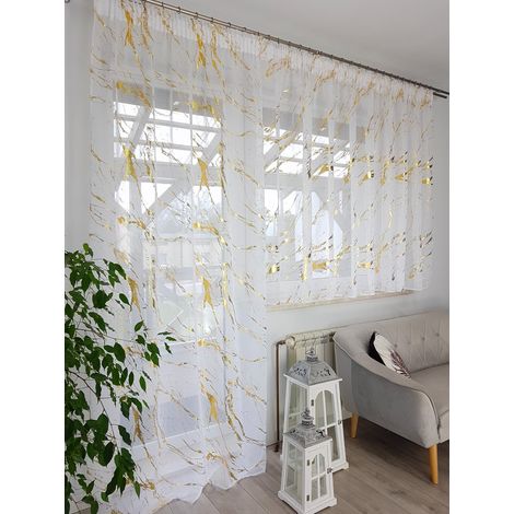 Conjunto de cortinas de balcón color sable con un elegante estampado dorado cosido en una cinta. (1/5)