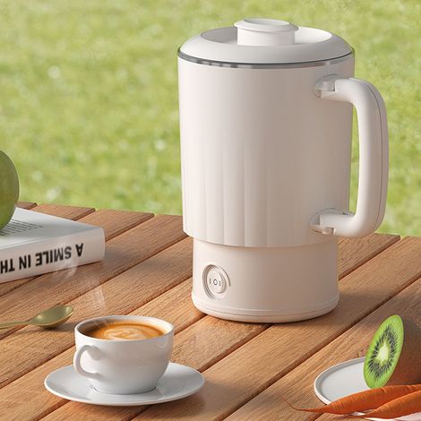 Bouilloire électrique portable blanche 600 ml, intérieur en acier inoxydable, isolation thermique, idéale pour le thé et le café, avec poignée pliable.