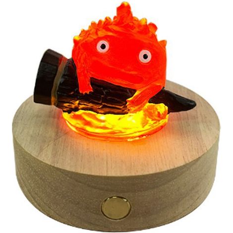 Matériaux de l'image : Bois, socle lumineux en bois massif du Château Ambulant, LED rechargeable Cassifa. (1/5)