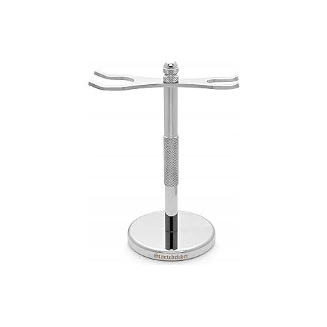 Soporte plateado para un cepillo y una maquinilla de afeitar o cortapelos. (1/3)