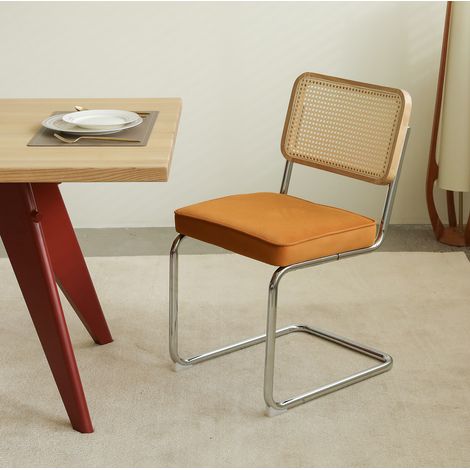Sedia da pranzo in rattan, velluto arancione, struttura cromata, impilabile (1/5)