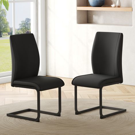 Lote de 2 sillas de comedor en PU negro, estructura metálica, respaldo ergonómico DESVIAE (1/5)