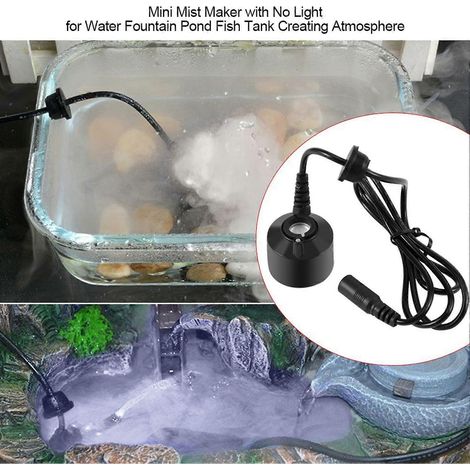 Fontaine miniature noire non éclairée, bassin et aquarium créent une ambiance. (1/5)